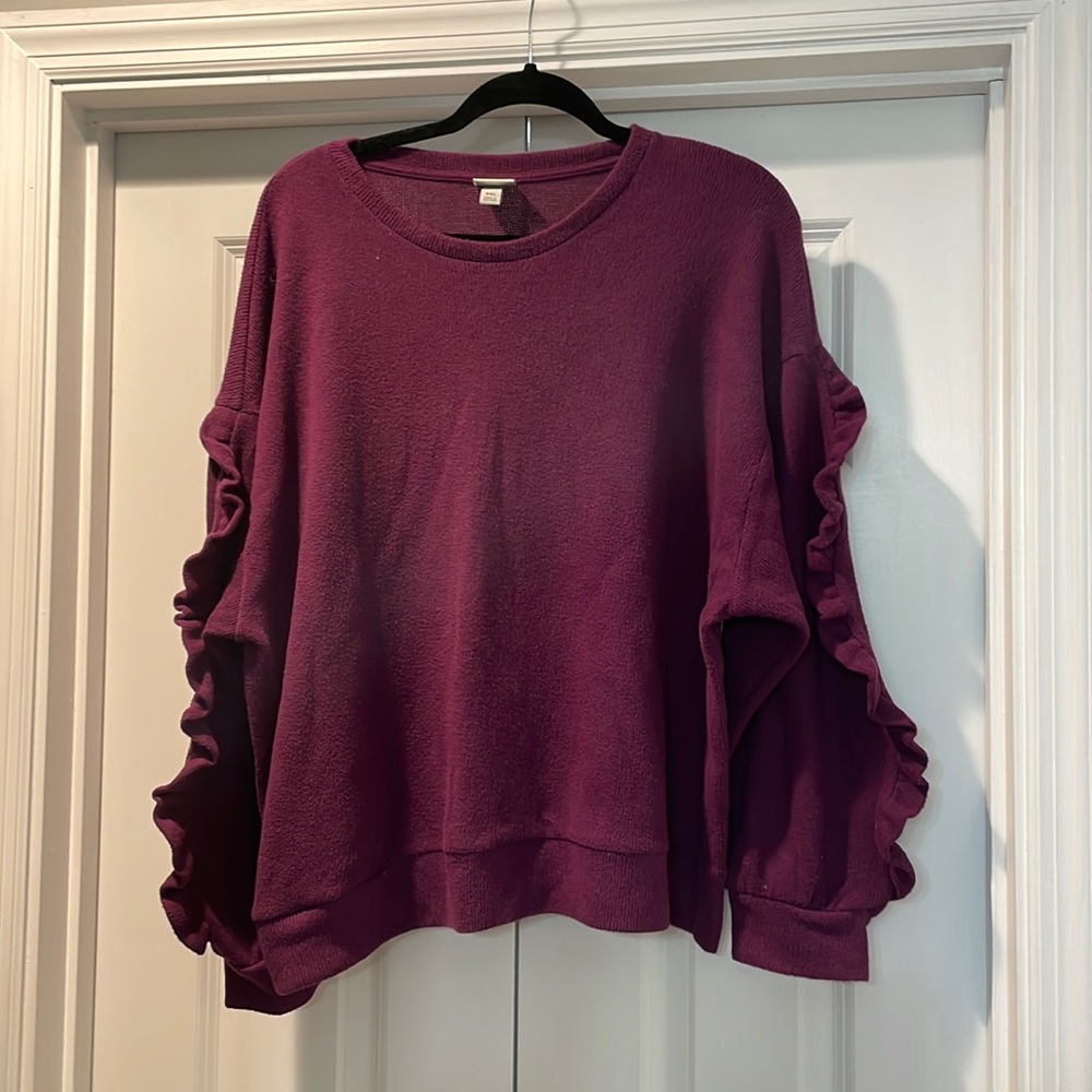 a new day sweater with cute ruffle details on the sleeves